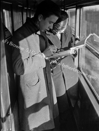 SCHOOL BOYS IN TRAIN